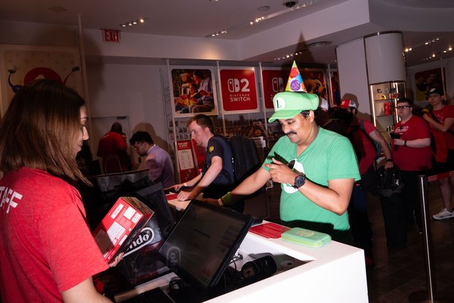 Customers wait in line to purchase Nintendo Switch 2 game consoles at a Nintendo Co. store in New York, US, early on Thursday, June 5, 2025. Nintendo fans stood in line for hours to be among the first to get ahold of the Switch 2 and take part in one of the biggest gadget debuts in years. (Photo by Adam Gray/Bloomberg)