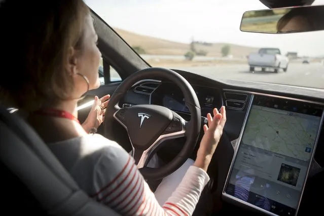 New Autopilot features are demonstrated in a Tesla Model S during a Tesla event in Palo Alto, California October 14, 2015. (Photo by Beck Diefenbach/Reuters)