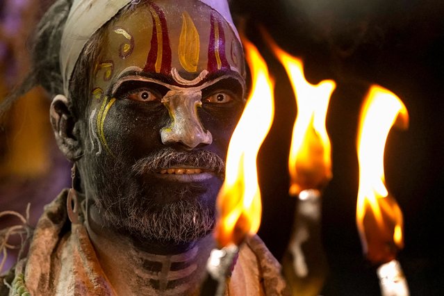 A devotee takes part in a ritualistic performance on the evening before new year as per the Hindu calendar, in Ajmer, India on April 8, 2024. (Photo by Himanshu Sharma/AFP Photo)