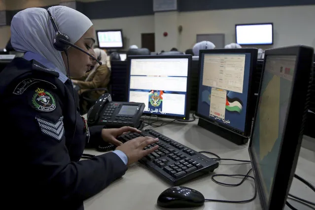 In this Tuesday, March 20, 2018 photo, a dispatcher takes down information from a caller at Jordan's 911 emergency call center in Amman, Jordan. The U.S.-funded operation is part of a broader program of upgrading Jordan's domestic law enforcement efforts by the State Departments Anti-Terrorism Assistance. (Photo by Raad Adayleh/AP Photo)