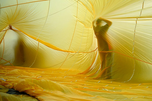 Hot air balloons are prepared for take off into the skies over the city, to preview the upcoming Bristol International Balloon Fiesta, on July 25, 2025 in Bristol, England. Now in its 47th year, the Bristol International Balloon Fiesta is Europe's largest annual hot-air balloon event in a city that is seen by many balloonists as the home of modern ballooning. This year's main event takes place in the hills of Ashton Court from August 8-10. (Photo by Finnbarr Webster/Getty Images)