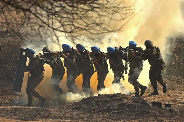 Soldiers conduct a joint validation drill during Africa-India field training exercise (AFINDEX-2023), in Pune on March 29, 2023. (Photo by Money Sharma/AFP Photo)