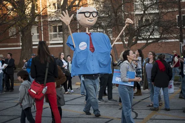 A supporter of U.S. Democratic presidential candidate Bernie Sanders wears a marionette costume at a rally ahead of the Democratic debate in Des Moines, Iowa November 14, 2015. (Photo by Mark Kauzlarich/Reuters)
