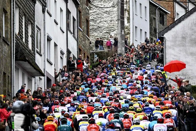 The pack of riders cycles during the men's elite race of the Liege-Bastogne-Liege one day cycling event, 258,5 km round-trip from Liege via Bastogne, on April 23, 2023. (Photo by Jasper Jacobs/Belga via AFP Photo)