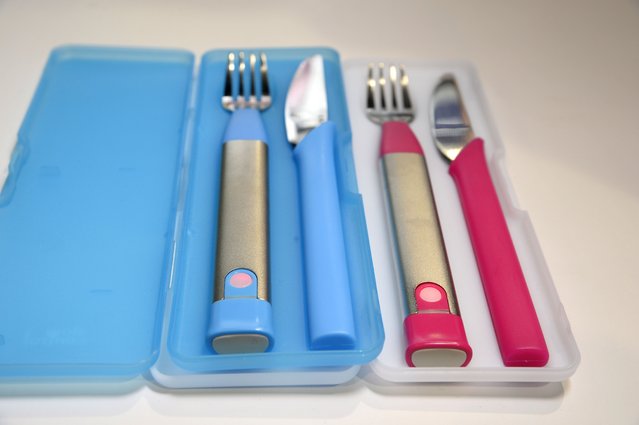 The 10S Fork by Slow Control of France helps people improve their eating behavoir by teaching them to eat more slowly, January 7, 2015 at the Consumer Electronics Show in Las Vegas Nevada.  A red alarm in the fork's handle lights up and the fork vibrates when the fork enters the mouth in shorter than ten second intervals,  reminding the user to eat more slowly.  The fork also collects and evaluates the eating speed data. (Photo by Robyn Beck/AFP Photo)
