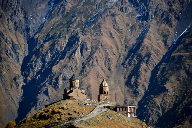 A picture shows 14th century Gergeti church in the village of Stepantsminda (former Kazbegi) close to Russian-Georgian border, some 160 km north of the capital Tbilisi. (Photo by Kirill Kudryavtsev/AFP Photo)