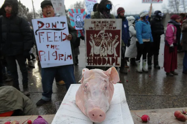 Protesters block Route 6 in Mandan on Thanksgiving day during a protest against plans to pass the Dakota Access pipeline near the Standing Rock Indian Reservation, North Dakota, U.S. November 24, 2016. (Photo by Stephanie Keith/Reuters)