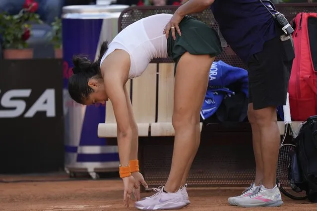 British tennis player Emma Raducanu receives medical treatment during her match against Bianca Andreescu at the Italian Open tennis tournament, in Rome, Tuesday, May 10, 2022. (Photo by Andrew Medichini/AP Photo)
