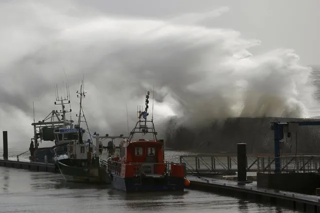 A crashes on the protecting wall at the fishing harbour in Pornic, France as stormy weather with high winds hits the French Atlanitic coast January 11, 2016. (Photo by Stephane Mahe/Reuters)