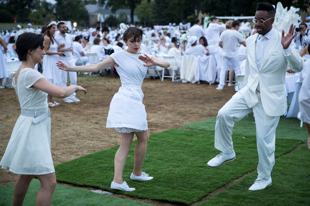 Diner En Blanc, a secret pop up dinner, is held this year on Governors Island in New York, U.S., September 17, 2018. (Photo by Erik Thomas/The New York Post).