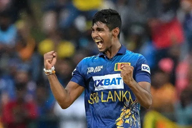 Sri Lanka's Matheesha Pathirana celebrates after taking the wicket of Bangladesh's Mushfiqur Rahim (not pictured) during the Asia Cup 2023 one-day international (ODI) cricket match between Sri Lanka and Bangladesh at the Pallekele International Cricket Stadium in Kandy on August 31, 2023. (Photo by Ishara S. Kodikara/AFP Photo)