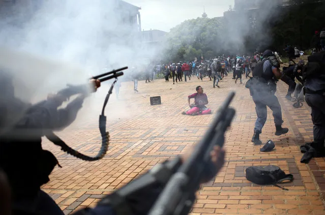 A student is seen during clashes with South African police at Johannesburg's University of the Witwatersrand, South Africa, October 4, 2016. (Photo by Siphiwe Sibeko/Reuters)