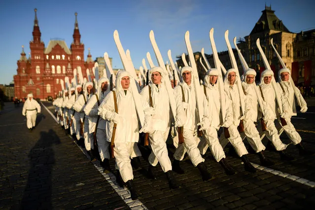 Russian servicemen dressed in historical uniforms take part in the military parade rehearsal at Red Square in Moscow on November 5, 2018. Russia marks the 77 th anniversary of the 1941 historical parade on November 7, when Red Army soldiers marched past the Kremlin walls towards the front line to fight Nazi Germany troops during World War Two. (Photo by Kirill Kudryavtsev/AFP Photo)