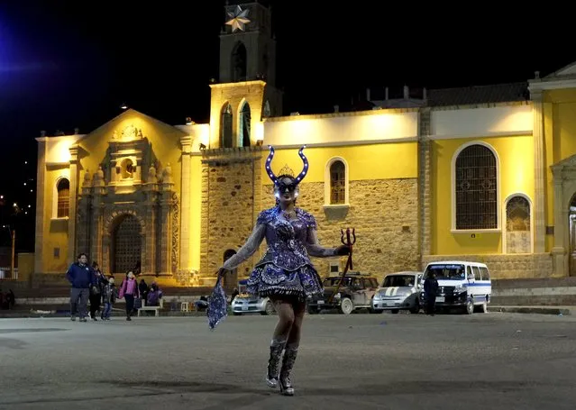 Alicia Vargas, 23, a performer from the Urus Diablada group, practices in front of the Socavon church ahead of Carnival in Oruro, Bolivia February 5, 2016. (Photo by David Mercado/Reuters)