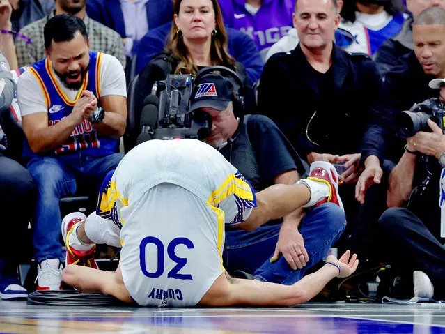 Golden State Warriors guard Stephen Curry (30) is flipped upside down after a play during the second quarter against the Sacramento Kings at Golden 1 Center on November 28, 2023 in Sacramento, California. (Photo by Sergio Estrada/USA TODAY Sports)