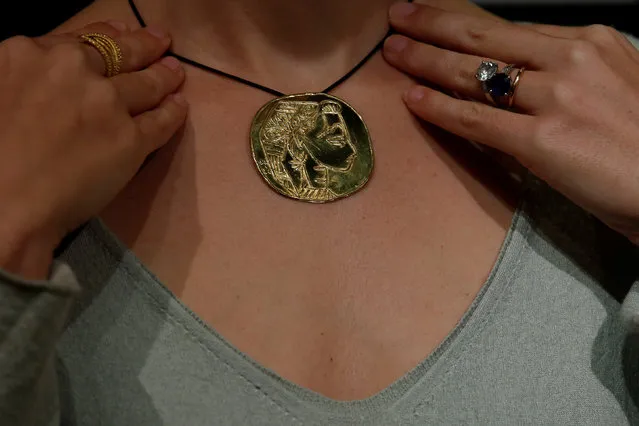 A gold medallion from a set of 28 by Pablo Picasso, estimated between  $449,000 and $513,000 by Sotheby's, is shown at a preview by the auction house in Hong Kong, China January 13, 2017. (Photo by Bobby Yip/Reuters)