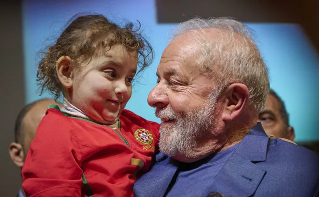 Brazilian President-Elect Luiz Inácio Lula da Silva (Lula) holds a child onstage at the end of his speech to members of organizations in the Brazilian community that supported him in the election, at Iscte – Instituto Universitario de Lisboa, on November 19, 2022, in Lisbon, Portugal. Luiz Inácio Lula da Silva, known as Lula, is a Brazilian politician, trade unionist, former metalworker and a member of the Workers' Party, was the 35th president of Brazil from 2003 to 2010. After winning the 2022 Brazilian general election, he will be sworn in on January 01, 2023, as the 39th president of Brazil, succeeding Jair Bolsonaro. (Photo by Horacio Villalobos#Corbis/Corbis via Getty Images)