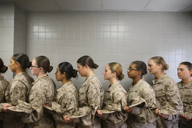 Female Marine recruits stand in line before getting lunch in the chow hall during boot camp on February 26, 2013 at MCRD Parris Island, South Carolina. (Photo by Scott Olson/Getty Images)