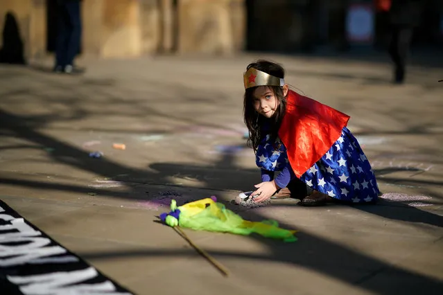 A young girl from a nursery school dresses as a super hero to save the planet as she joins other schoolchildren and students taking part in a student climate change strike on February 15, 2019 in Manchester, United Kingdom. Thousands of UK pupils from schools, colleges and universities will walk out today for a nationwide climate change strike. Students in 60 cities from the West Country to Scotland are protesting, urging the government to declare a climate emergency and take action over the problem. They are keen that the national curriculum is reformed and the environmental crisis is communicated to the public. Similar strikes have taken place in Australia and in European countries such as Belgium and Sweden. (Photo by Christopher Furlong/Getty Images)