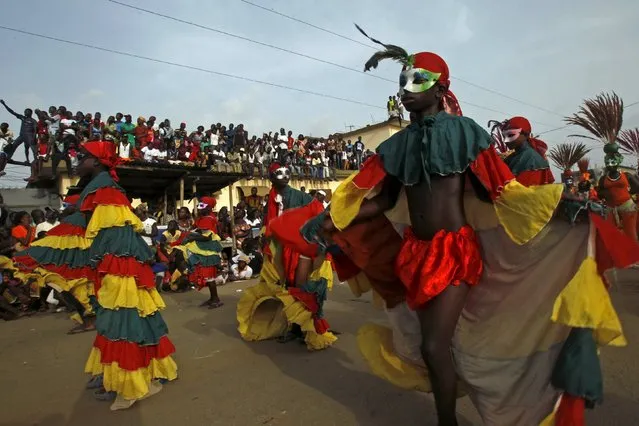 Participants take part in a parade during the Popo (Mask) Carnival of Bonoua, in the east of Abidjan, April 18, 2015. (Photo by Luc Gnago/Reuters)
