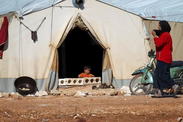 An internally displaced Syrian child sits in a tent inside Safsafa camp, northern Idlib countryside, Syria March 1, 2016. (Photo by Ammar Abdullah/Reuters)