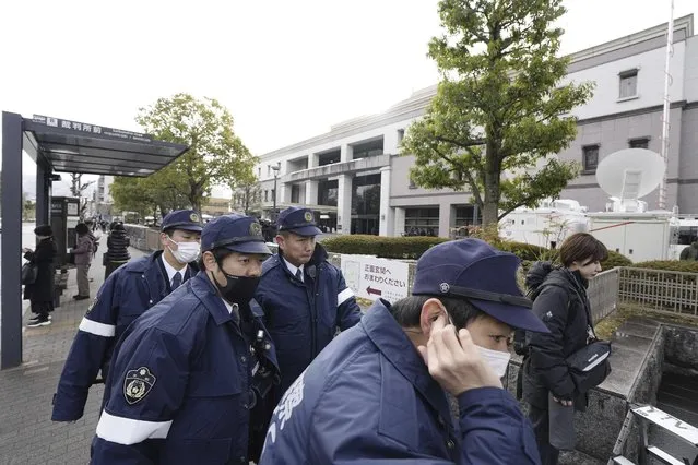 Police officers gather outside the Kyoto District Court in Kyoto, western Japan, Thursday, January 25, 2024, ahead of the sentencing hearing for Shinji Aoba, who has confessed to a deadly arson attack in July 2019 on a Kyoto Animation Co. studio. Aoba was convicted of murder and other crimes Thursday for carrying out the shocking arson attack on the anime studio that killed 36 people and drew an outpouring of grief from anime fans worldwide. (Photo by Miki Matsuzaki/Kyodo News via AP Photo)