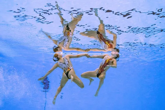 Britain's Kate Shortman and Isabelle Thorpe compete in the preliminary round of the women's duet free Group B artistic swimming event during the 2024 World Aquatics Championships at Aspire Dome in Doha on February 7, 2024. (Photo by Oli Scarff/AFP Photo)