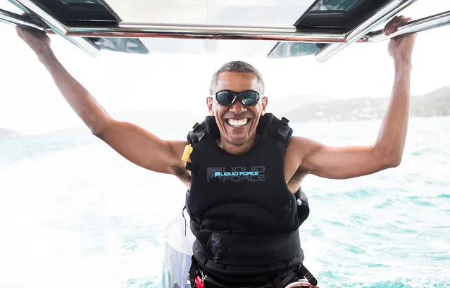 Former U.S. President Barack Obama sits on a boat during a kite surfing outing with British businessman Richard Branson during his holiday on Branson's Moskito island, in the British Virgin Islands, in a picture handed out by Virgin on February 7, 2017. (Photo by Jack Brockway/Reuters/Virgin)