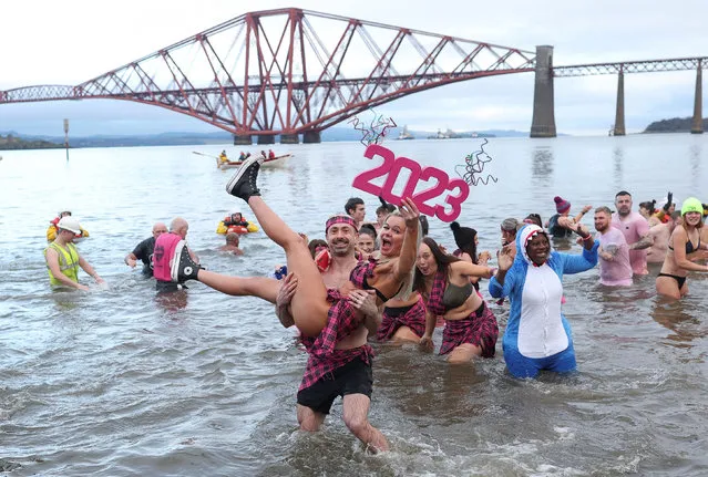 Revellers participate in a New Year's Day swim, locally often referred to as a 'loony dook', at South Queensferry, Scotland, Britain on January 1, 2023. (Photo by Russell Cheyne/Reuters)