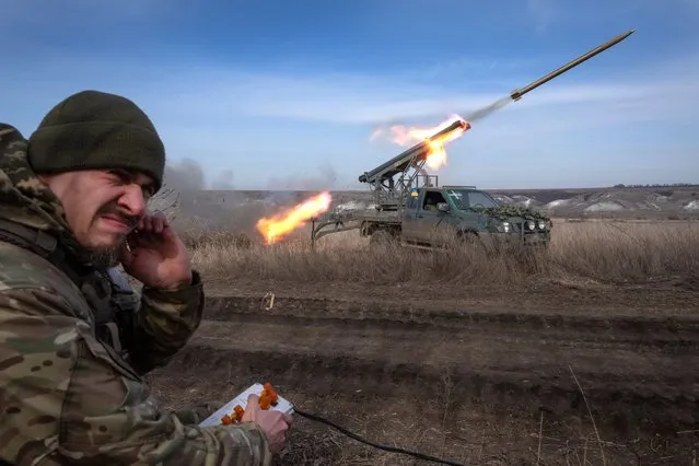 A Ukrainian officer from The 56th Separate Motorized Infantry Mariupol Brigade fires a multiple launch rocket system based on a pickup truck towards Russian positions at the front line, near Bakhmut, Donetsk region, Ukraine, Tuesday, March 5, 2024. (Photo by Efrem Lukatsky/AP Photo)
