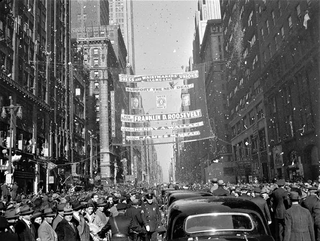 Crowds and a paper storm greet President Franklin D. Roosevelt as he drives down 7th Ave. in New York City, October 28, 1940. (Photo by AP Photo)