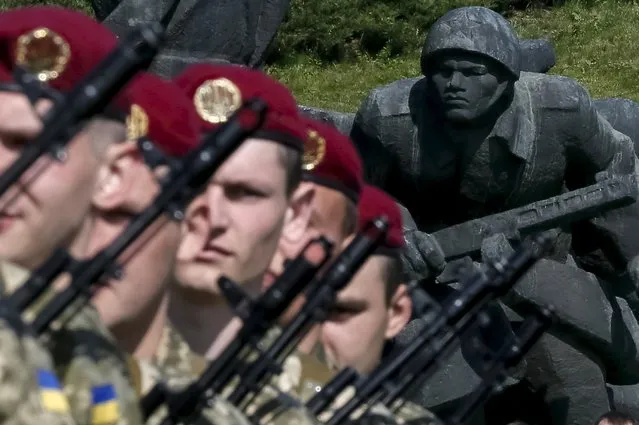 Recruits from the presidential regiment take part in Victory Day celebrations in the Museum of the Great Patriotic War in Kiev, Ukraine May 9, 2015. Spurning what is expected to be a display of military swagger in Moscow on Saturday, Kiev plans to put the accent at home on reconciliation rather than triumphalism and victory. (Photo by Gleb Garanich/Reuters)