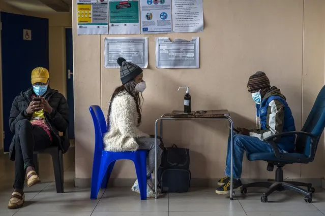 People register for COVID-19 vaccination at Soweto's Baragwanath hospital, South Africa, Monday December 13, 2021. South Africa's 7-day rolling average of daily new COVID-19 cases has risen over the past two weeks from 7.60 new cases per 100,000 people on Nov. 28 to 32.71 new cases per 100,000 people on Dec. 12, according to Johns Hopkins University. In general, the new omicron cases have resulted in milder cases, with fewer hospitalizations and less severe cases requiring oxygen or intensive care. (Photo by Jerome Delay/AP Photo)