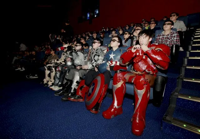 A group of fans dressed in homemade replica armours of “Avengers: Age of Ultron” movie characters, Iron Man, Captain America and Thor, watch the film in a theatre in Changchun, Jilin province, China, May 16, 2015. The group, led by college student Zu Bingqun, spent about 70,000 yuan to make the replica armours for all the main characters in the movie, local media reported. (Photo by Reuters/Stringer)