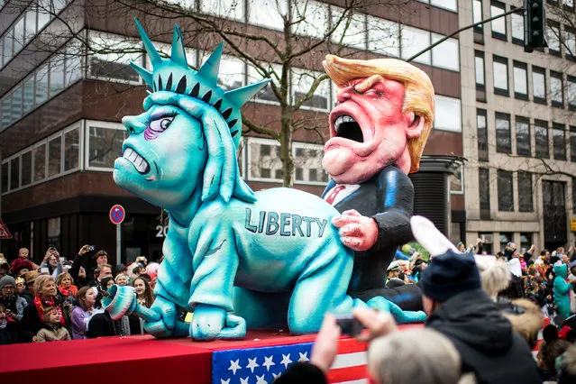 A float featuring U.S. President Donald Trump and the Statue of Liberty drives in the annual Rose Monday parade on February 27, 2017 in Dusseldorf, Germany. (Photo by Lukas Schulze/Getty Images)