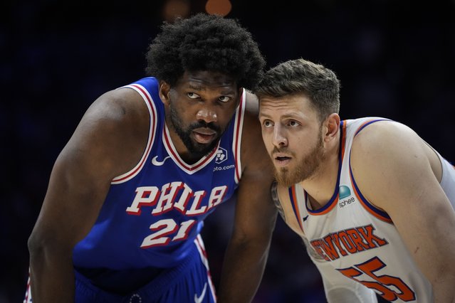 Philadelphia 76ers' Joel Embiid, left, and New York Knicks' Isaiah Hartenstein, right, guard against each other during the second half of Game 6 in an NBA basketball first-round playoff series, Thursday, May 2, 2024, in Philadelphia. (Photo by Matt Slocum/AP Photo)