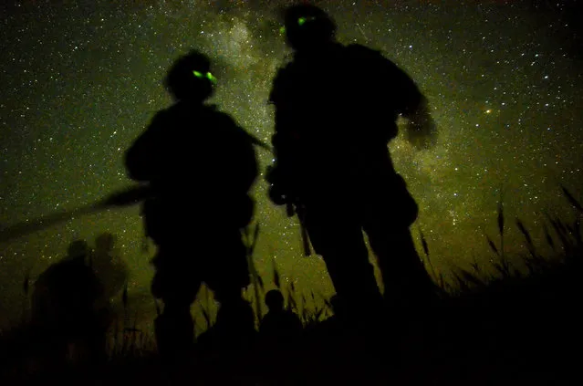 U.S. Army soldiers with the 1st Battalion, 501st Infantry Regiment deployed to Combat Outpost Sabari, Afghanistan scan their area as they begin a multi-day air assault mission near the Pakistani border of eastern Afghanistan's Khost province May 2, 2012. (Photo by Staff Sgt. Joshua L. DeMotts/U.S. Air Force)