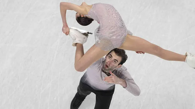 Karina Safina and Luka Berulava, of Georgia, compete in the pairs free skate program during the figure skating competition at the 2022 Winter Olympics, Saturday, February 19, 2022, in Beijing. (Photo by Jeff Roberson/AP Photo)