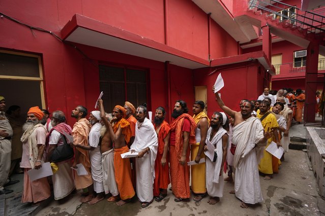 Hindu holy men stand in a queue in Jammu, India, to register for the annual pilgrimage to the Amarnath cave shrine, Thursday, June 27, 2024. The pilgrimage held annually to the holy Amarnath cave, dedicated to Hindu god Shiva is scheduled to start on June 29 this year. (Photo by Channi Anand/AP Photo)