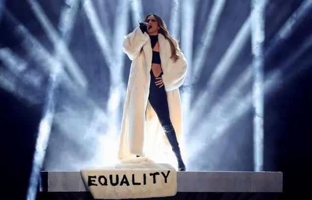 Jennifer Lopez wears a long white coat with the words “Equality” on it as she performs at the iHeartRadio Music Awards, at Shrine Auditorium in Los Angeles, California, U.S., March 22, 2022. (Photo by Mario Anzuoni/Reuters)