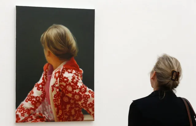 A woman looks at the oil on canvas painting “Betty” from 1988 by German artist Gerhard Richter during a media preview of the exhibition “Gerhard Richter” at the Fondation Beyeler in Riehen near Basel May 16, 2014. The exhibition will be open to the public from May 18 to September 7. (Photo by Arnd Wiegmann/Reuters)