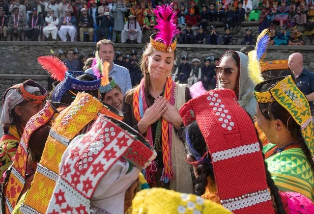 Catherine, Duchess of Cambridge visits a settlement of the Kalash people in Chitral, Pakistan, October 16, 2019. Catherine and her husband Prince William visited a settlement of the Kalash people, a small indigenous group living in the Chitral region where they met with young people and wore colorful local scarves and headwear while being treated to song and dance, during a five-day visit to the South Asian nation. (Photo by Samir Hussein/Pool via Reuters)