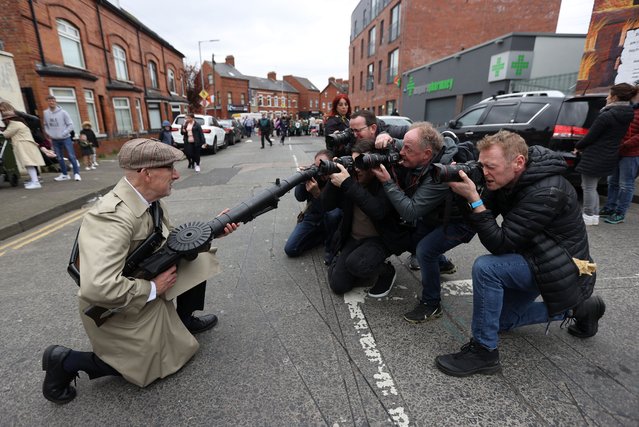 Reenactor Eddie O'Neill has his picture taken at Beechmount Avenue near the Falls Road, Belfast on Sunday, April 9, 2023, before taking part in a parade organised by Sinn Fein to Milltown Cemetery to mark the anniversary of the 1916 Easter Rising. (Photo by Liam McBurney/PA Images via Getty Images)