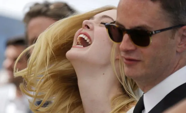 Cast member Elle Fanning (L) and director Nicolas Winding Refn pose during a photocall for the film “The Neon Demon” in competition at the 69th Cannes Film Festival in Cannes, France, May 20, 2016. (Photo by Regis Duvignau/Reuters)