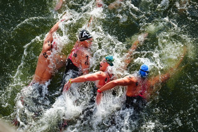 Competitors during the Men's 10km marathon swim at Pont Alexandre III on the fourteenth day of the 2024 Paris Olympic Games in France on Friday, August 9, 2024. (Photo by Mike Egerton/PA Images via Getty Images)