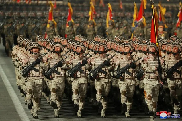 This picture taken on April 25, 2022 and released from North Korea's official Korean Central News Agency (KCNA) on April 26 shows military personnel marching during a military parade to celebrate the 90th anniversary of the founding of the Korean People's Revolutionary Army at Kim Il Sung Square in Pyongyang. (Photo by KCNA via KNS/AFP Photo)