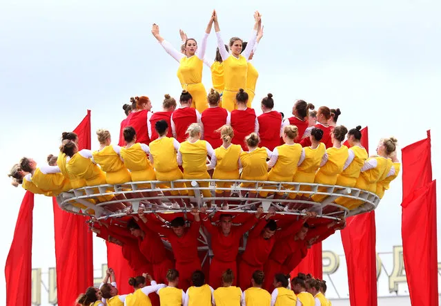 Belarussian people perform after a military parade as a part of the celebrations marking the Independence Day in Minsk, Belarus July 3, 2017. (Photo by Vasily Fedosenko/Reuters)