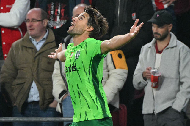 Sporting Lisbon's Portuguese midfielder #23 Daniel Braganca celebrates after scoring Sporting's first goal during the UEFA Champions League 1st round day 2 football match between PSV Eindhoven (NED) and Sporting Lisbon (POR) at the The Philips Stadion, in Eindhoven, on October 1, 2024. (Photo by Nicolas Tucat/AFP Photo)