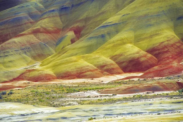 Layers of breathtaking colour streak the rolling hills of this vast desert, making the landscape appear as though it has been tie-dyed. The natural phenomenon, nicknamed the “Painted Desert”, was formed when the area was once a river floodplain. (Photo by Mark Brodkin/Solent News/SIPA Press)
