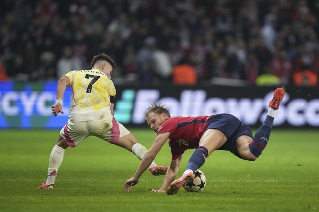 Lille's Mitchel Bakker, right, challenges for the ball with Juventus' Francisco Conceicao during the Champions League opening phase soccer match between Lille and Juventus at the Stade Pierre Mauroy in Villeneuve-d'Ascq, outside Lille, France, Tuesday, November 5, 2024. (Photo by Christophe Ena/AP Photo)